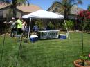 Bill Cooke (W7JZE) left, Sandra Lucero - middle, Dan Jordy - right (With Garden-Zombie far right corner).  2014 backyard, emergency solar / battery power FD station is setting up and getting ready to go!